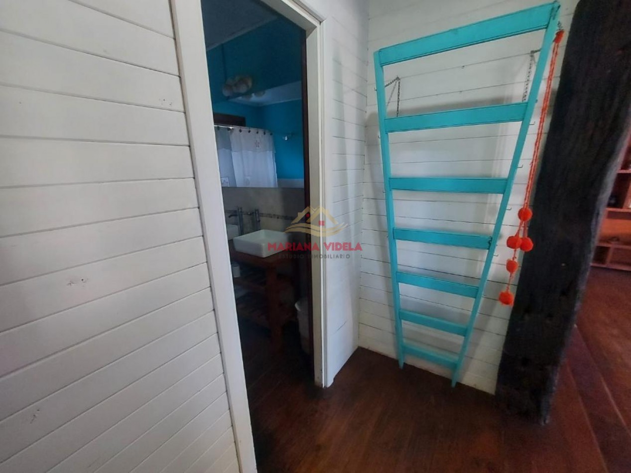 Casa en venta en Carilo, tipo cabaña.